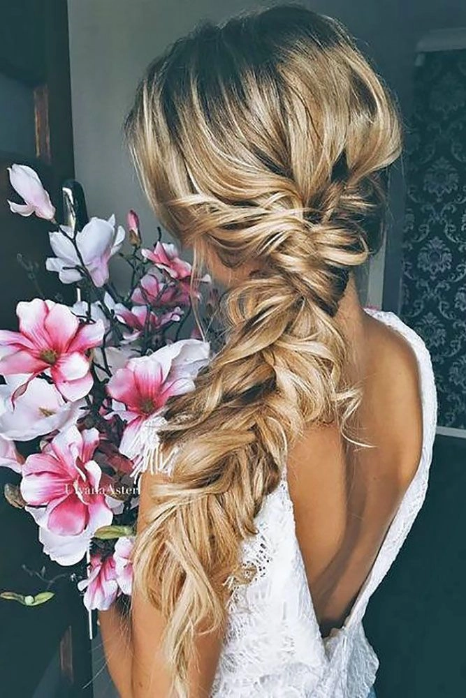 Wedding hairstyle featuring a romantic side braid for brides Elegant bridal hair with side braid styled for a wedding day look