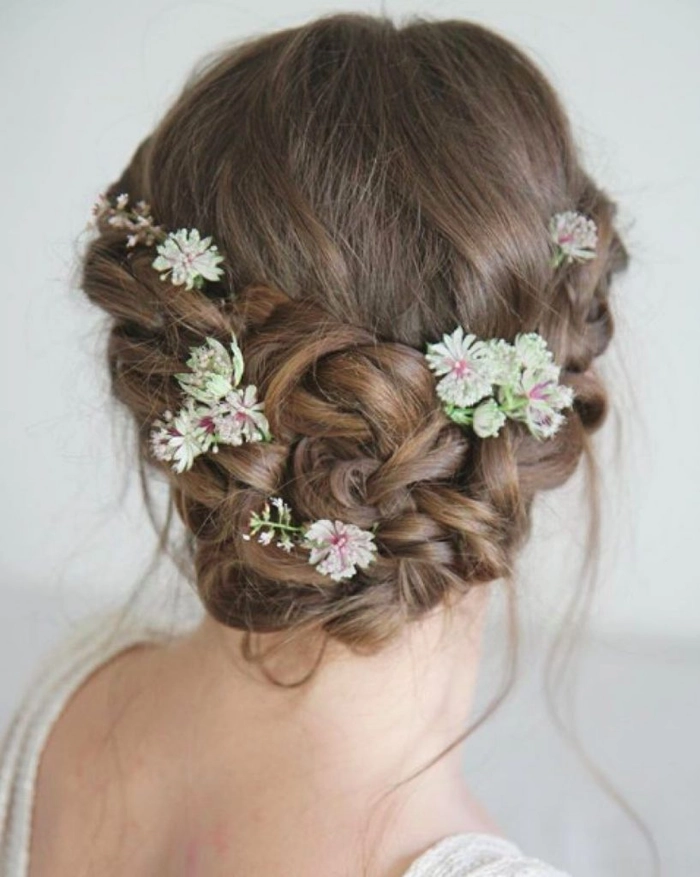 Elegant wedding hairstyle featuring fresh floral accents in bridal hair number 4 Bridal hairstyle adorned with fresh flowers for a romantic wedding look