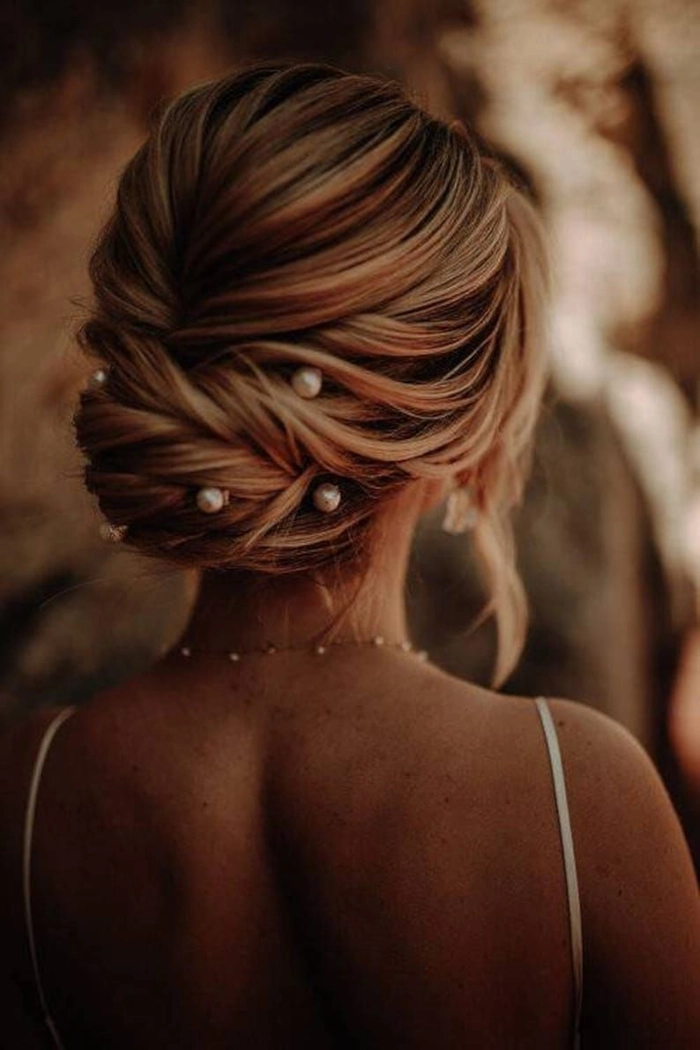 Bridal hair styled with pearl hair pins showcasing classic wedding elegance Elegant bridal hairstyle adorned with delicate pearl hair pins for a timeless wedding look