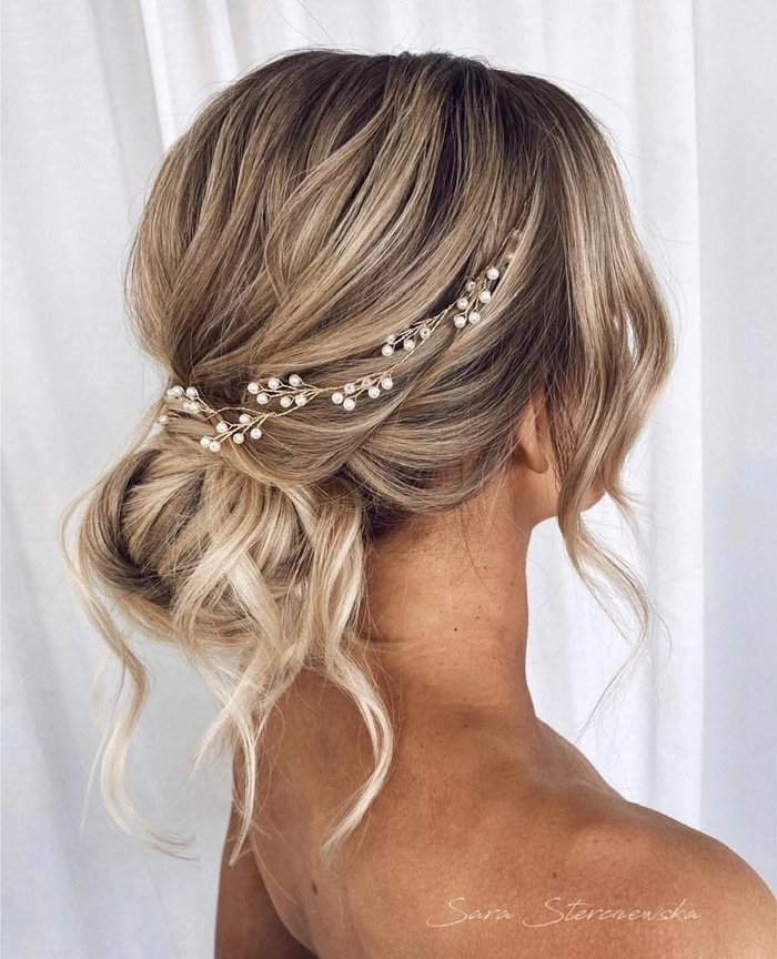 Sophisticated wedding hair adorned with delicate pearl accents for brides Bridal hairstyle featuring elegant pearl hair pins woven into soft curls