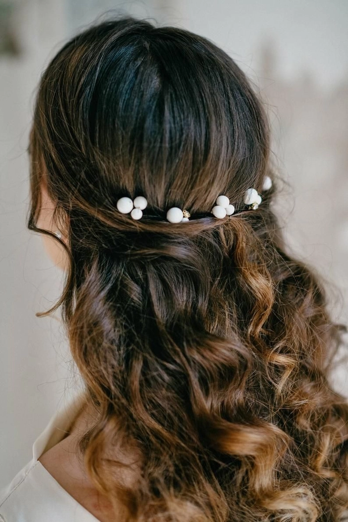 Bridal hair with pearl hair pins showcasing timeless elegance and grace in wedding hairstyles Elegant bridal hairstyle adorned with delicate pearl hair pins for a romantic wedding look