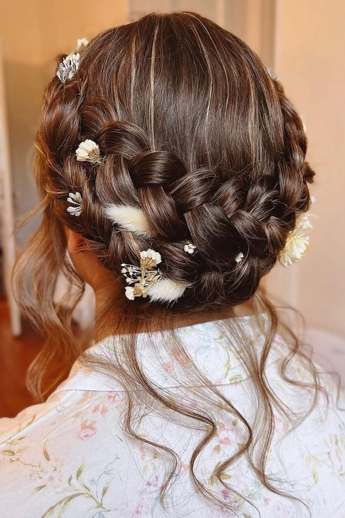 Bridal milkmaid braids hairstyle perfect for brides and wedding celebrations Elegant bridal milkmaid braids styled with delicate floral accents for a wedding look