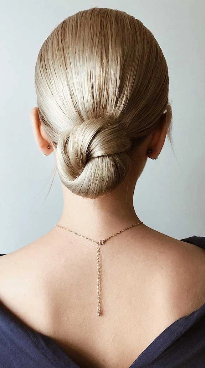 Bridal model showcasing long straight sleek hair for a wedding hairstyle