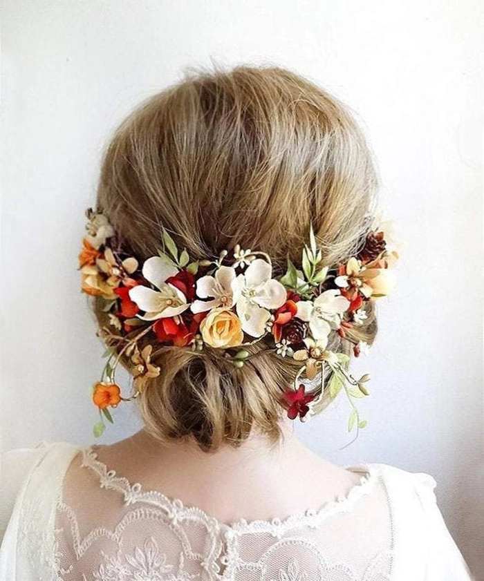 Bride with fall autumn wedding hair adorned with colorful leaves