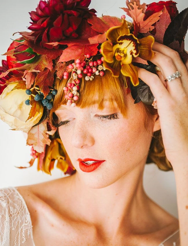 Bride with fall autumn wedding hair adorned with leaves for a romantic outdoor ceremony