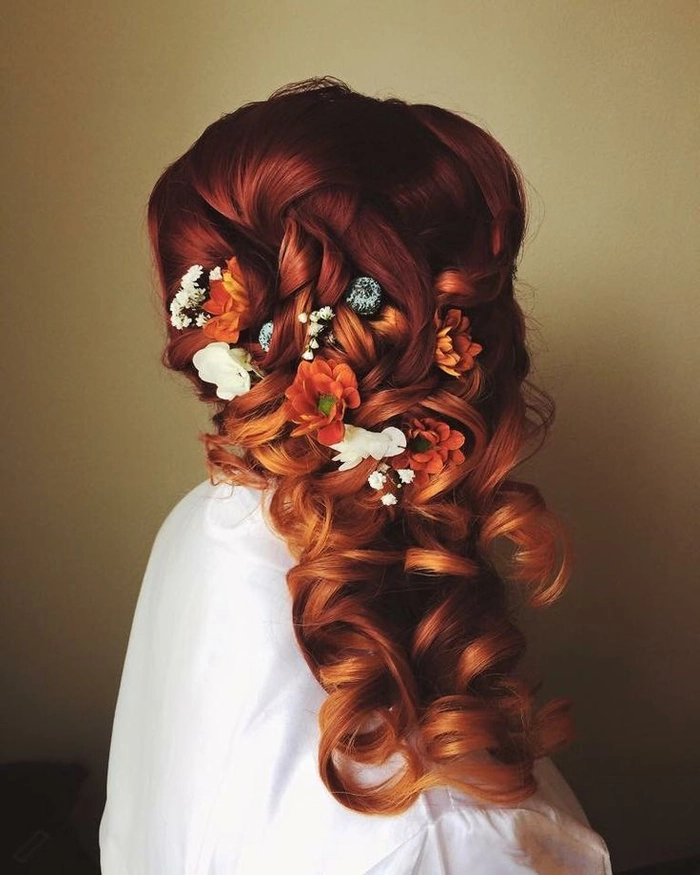 Bride with elegant fall autumn wedding hair adorned with colorful leaves