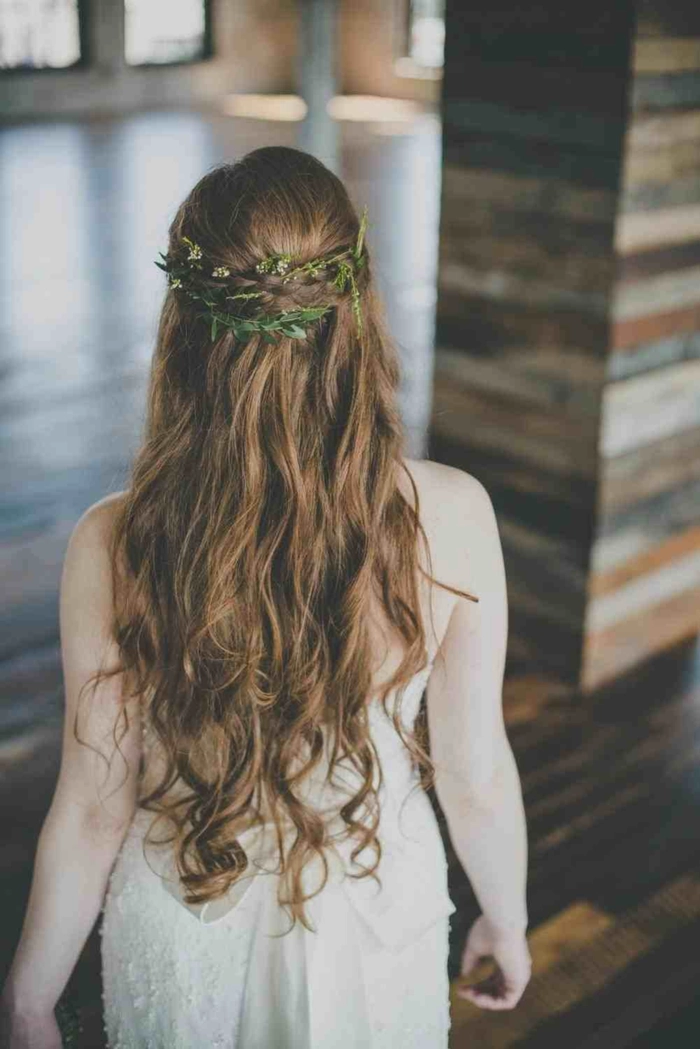 Bride with elegant Greek wedding hair adorned by a delicate olive wreath