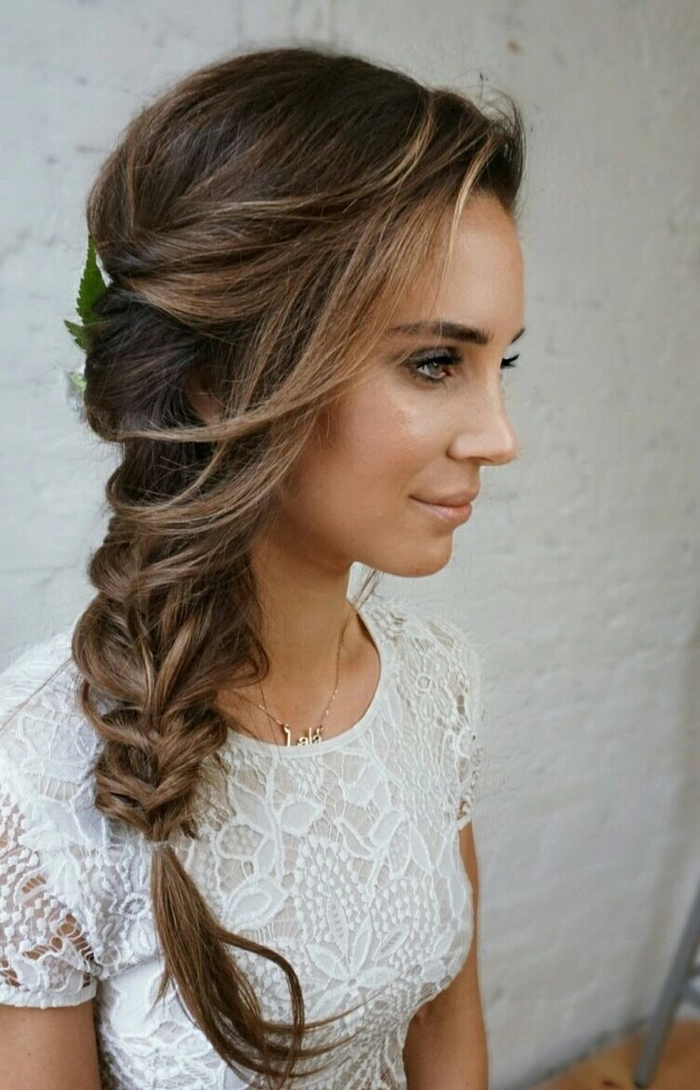 Beautiful wedding hairstyle featuring a side braid for brides looking for a romantic look Bride with elegant bridal hair styled in a side braid for a wedding day