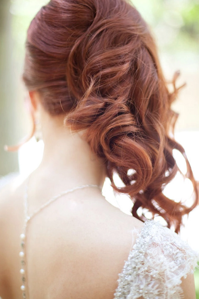 Romantic side swept curled hairstyle perfect for wedding day elegance Bride with elegant wedding hair side swept curls adorned with delicate floral accessories