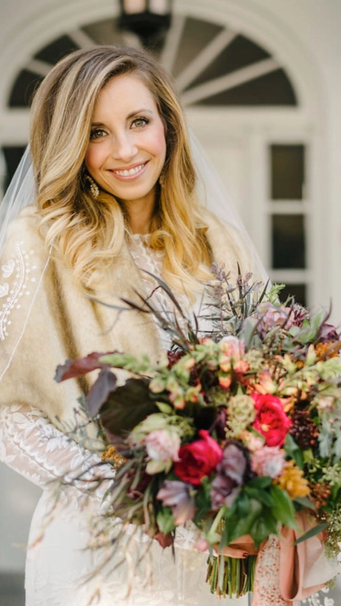 Bride with fall autumn wedding hair decorated with colorful leaves