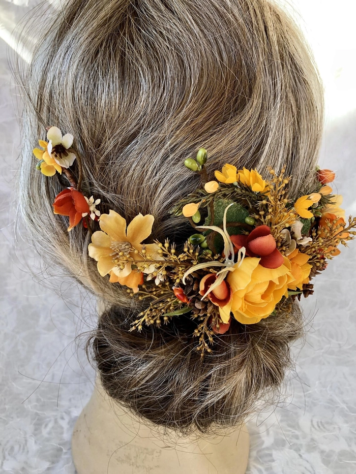 Bride with fall autumn wedding hair adorned with delicate leaves