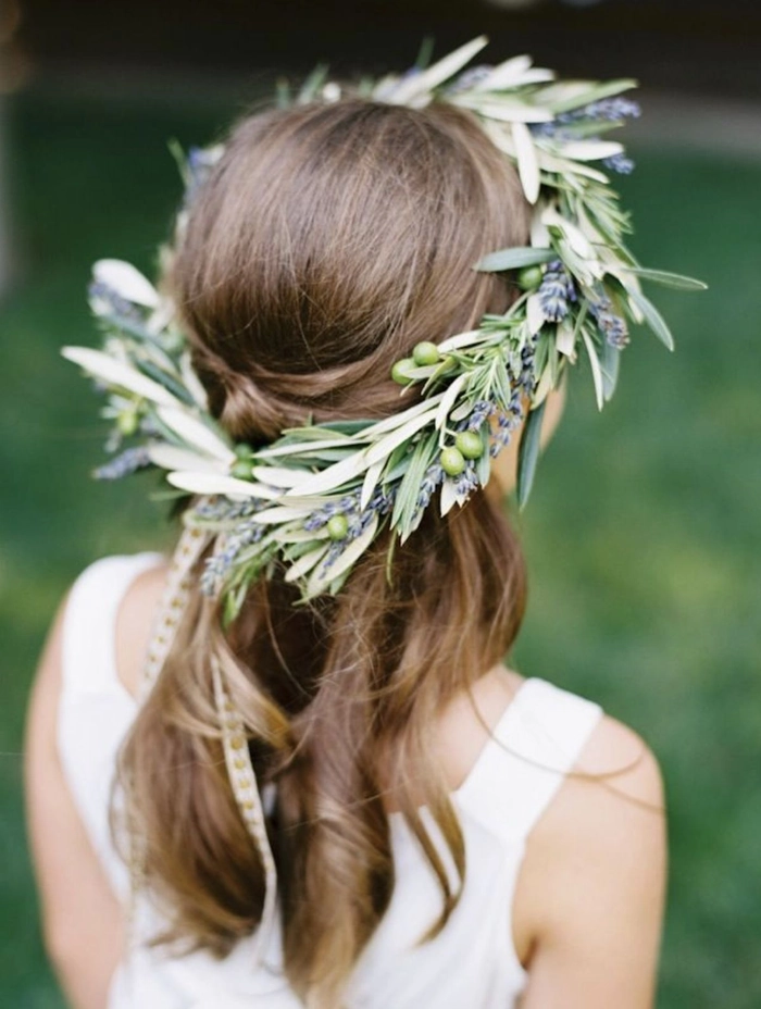 Bride showcasing elegant Greek wedding hair with olive wreath at the altar