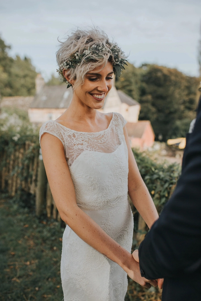 Elegant pixie cut wedding hairstyle featuring bridal hair accessories for a special day Bride with a pixie cut adorned with delicate floral wedding hair accessories