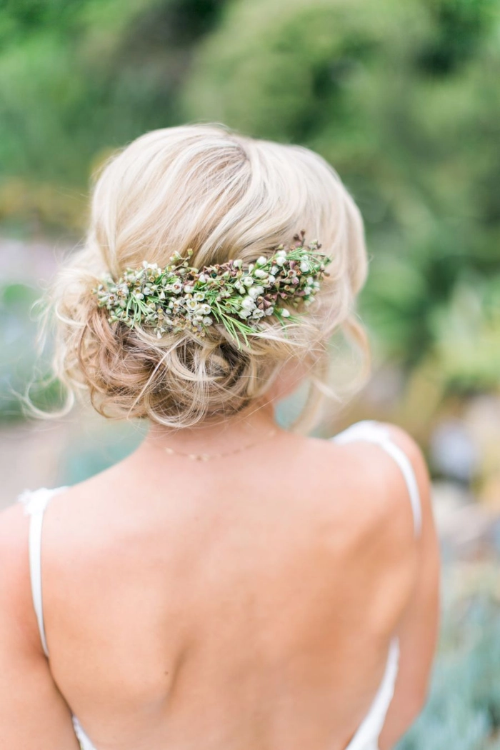Bride with spring garden wedding floral hair arrangement in loose curls