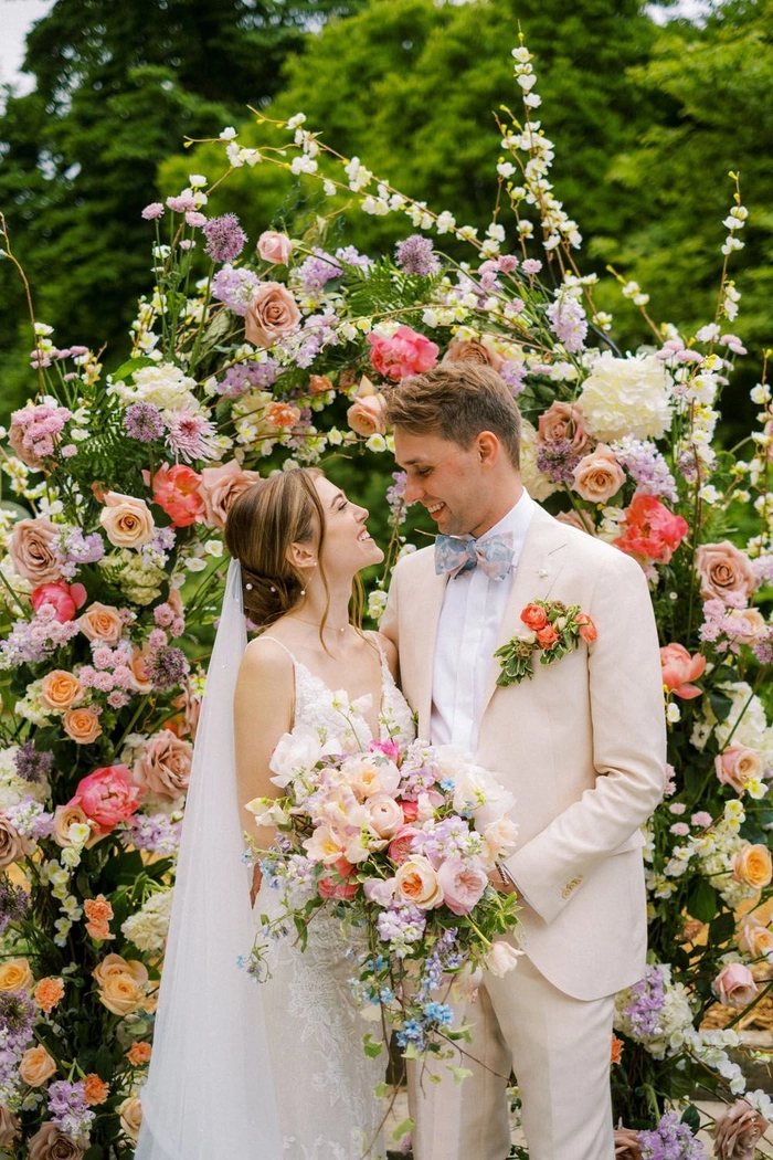 Bride with a spring garden wedding floral hair arrangement featuring fresh blooms