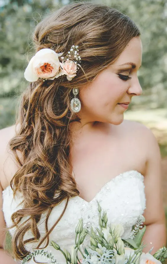 Wedding Hairstyles Gallery Image 4 featuring side swept curls for brides Bride with elegant wedding hair side swept curls styled for a romantic look