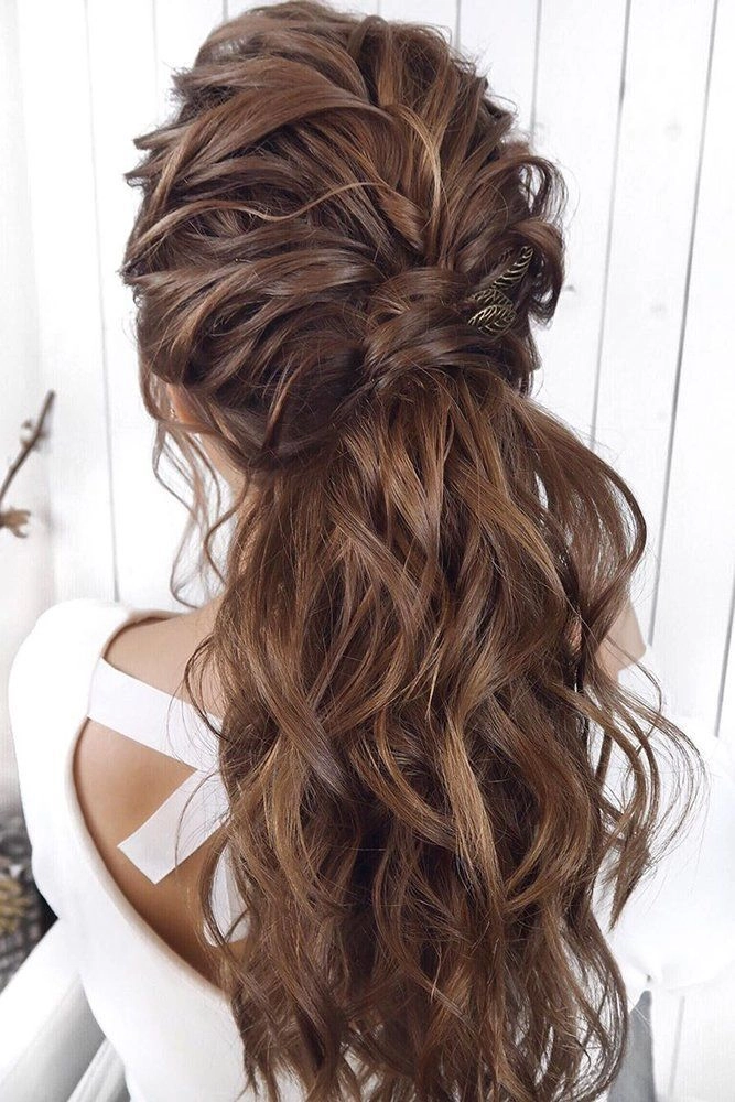 Bridesmaid hair styled beautifully for curly hair with elegant accessories