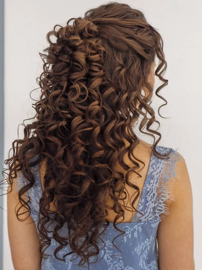 Bridesmaid with beautifully styled curly hair in an elegant updo
