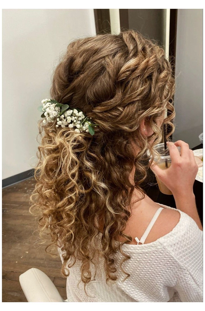 Bridesmaid hairstyle showcasing beautiful curly hair with elegant floral accents
