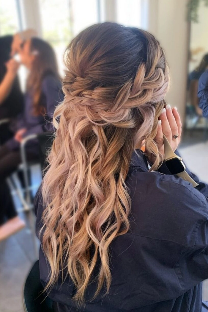 Stylish bridesmaid hairstyle featuring a half up half down design for weddings Bridesmaid with elegant half up half down hairstyle, perfect for wedding looks
