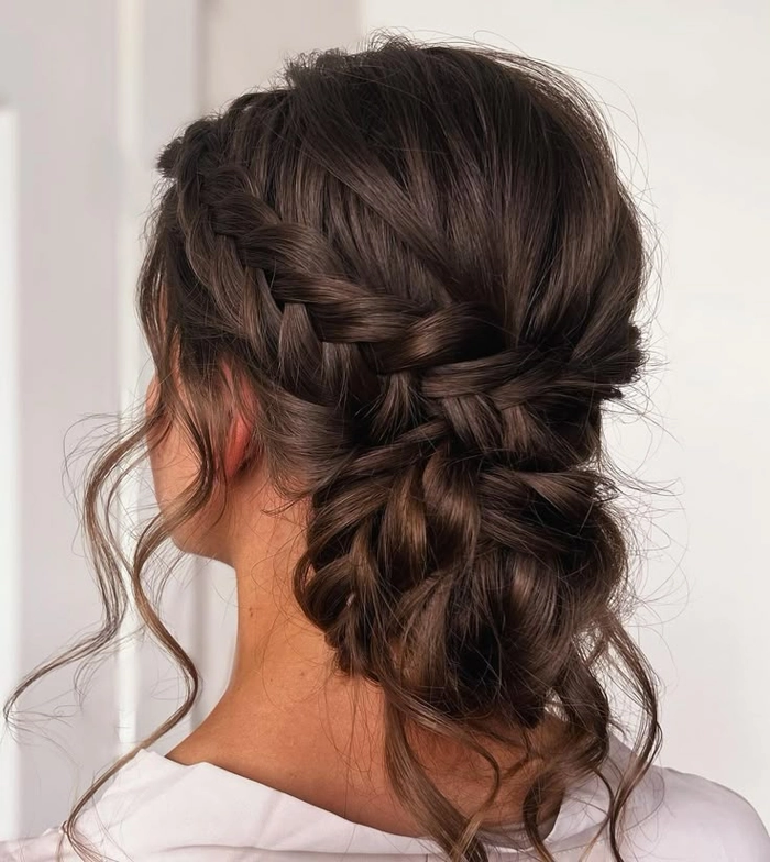 Elegant bridesmaid hairstyles for long hair featuring soft curls and floral accents