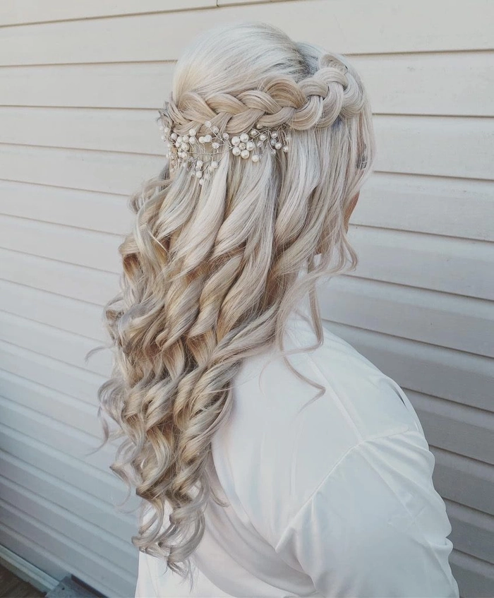Bridesmaid half up half down styles perfect for wedding day glamour Bridesmaid showcasing an elegant half up half down hairstyle with loose curls
