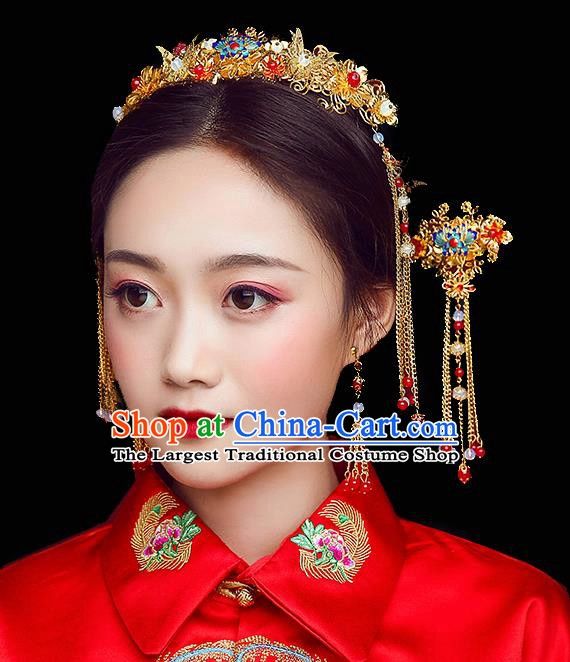 Elegant Chinese wedding hair with ornate hair sticks in a traditional bridal style