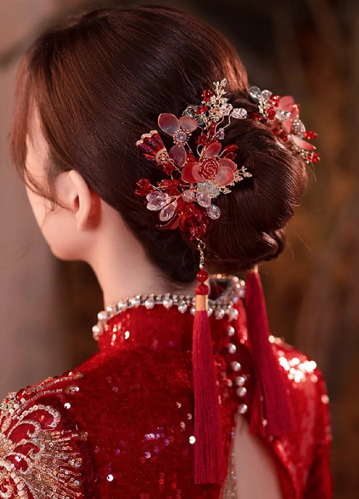 Elegant Chinese wedding hairstyle adorned with traditional hair sticks
