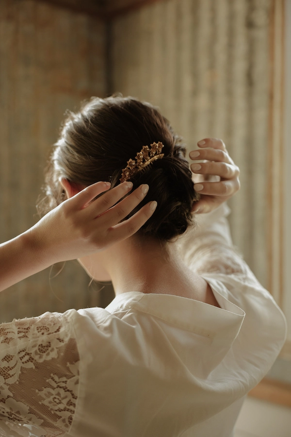 Soft, romantic cottagecore wedding hair style with loose waves and floral accents
