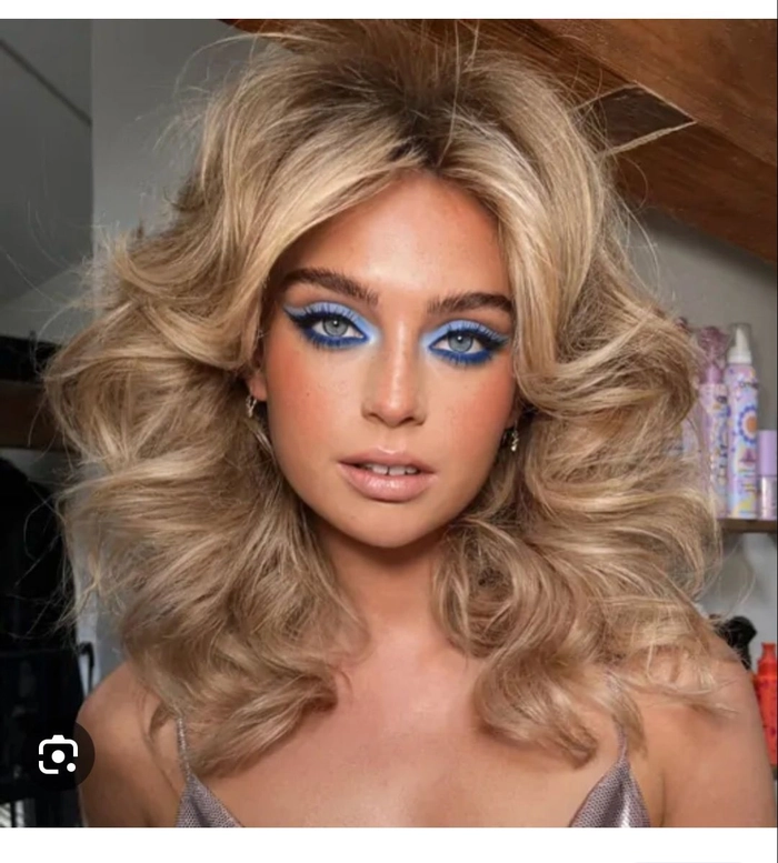 Glamorous s disco era bridal hair with voluminous curls and sparkling accessories