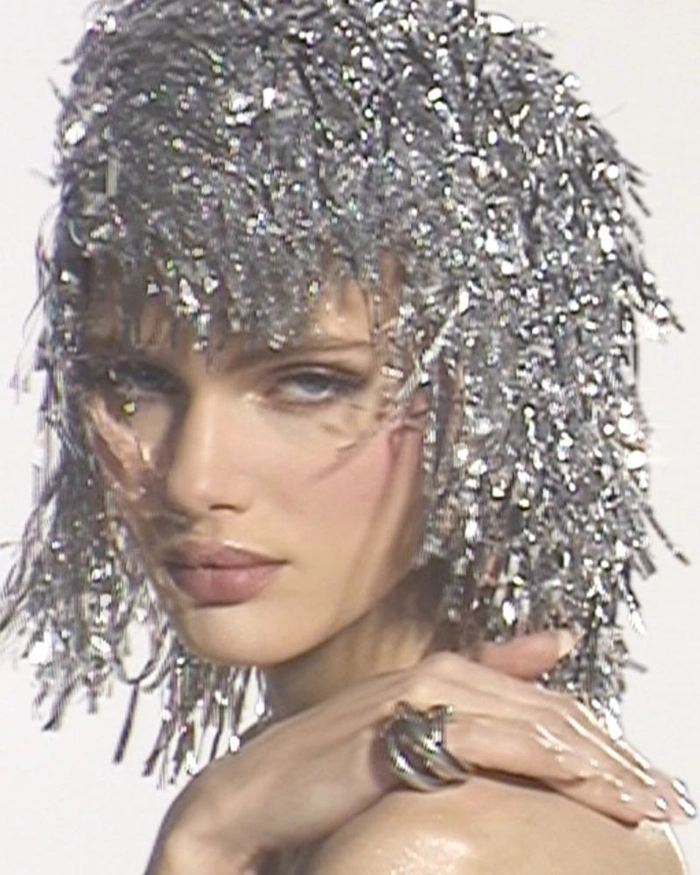 Classic disco era bridal hair with voluminous curls and glamorous shine