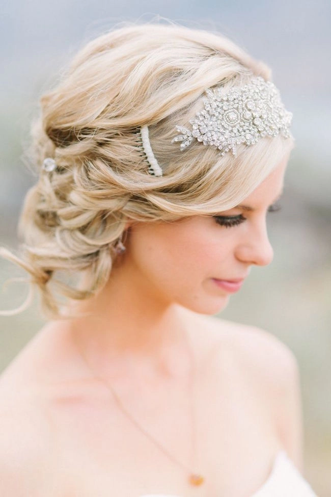 Elegant bridal hairstyle inspired by the disco era with voluminous curls and sparkle