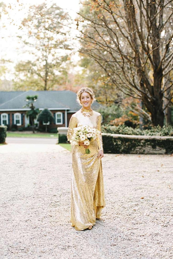 Elegant Edwardian wedding updo featuring intricate curls and floral accessories