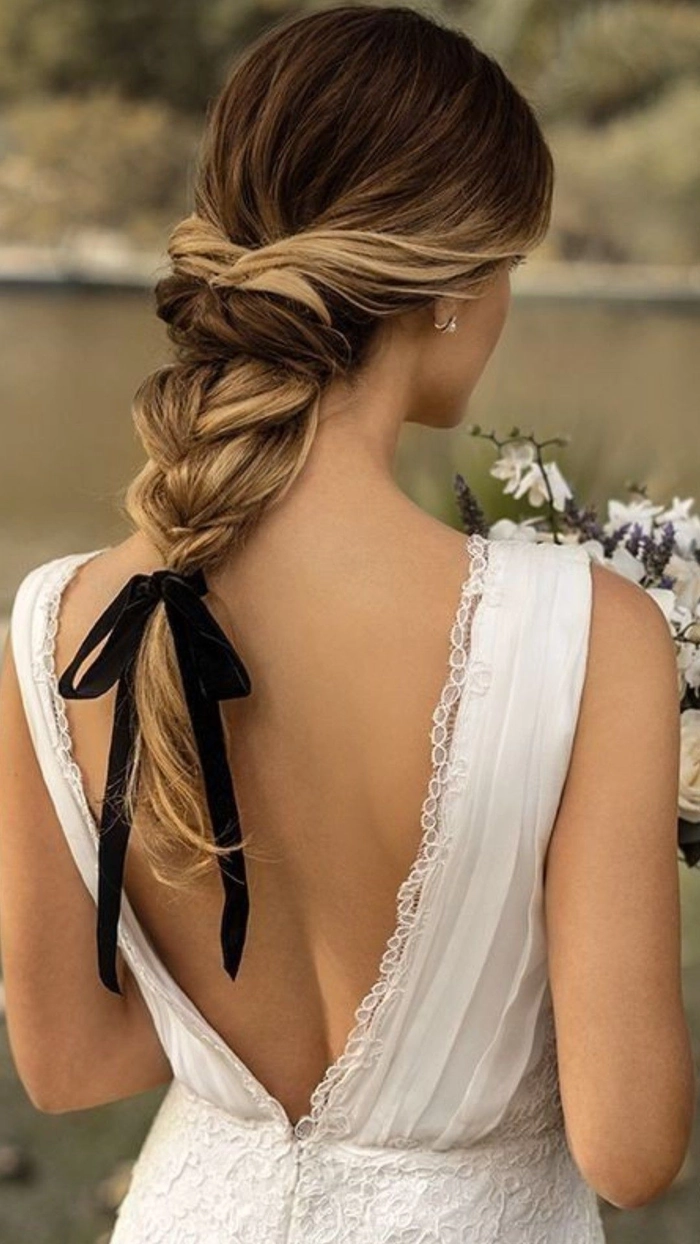 Elegant big hair wedding styles featuring voluminous curls and intricate accessories