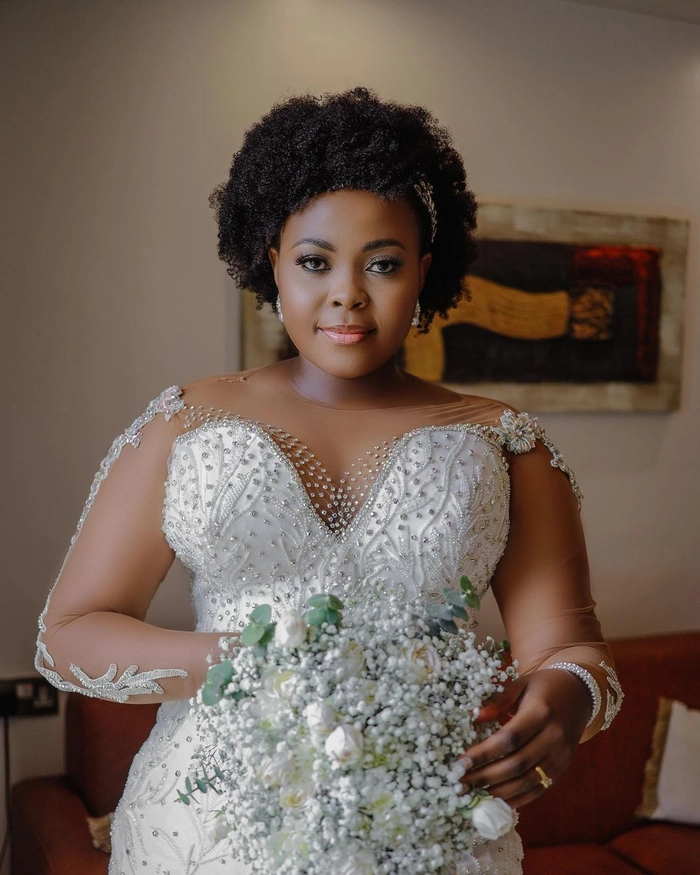 Elegant natural black hair bridal look with intricate styling and accessories