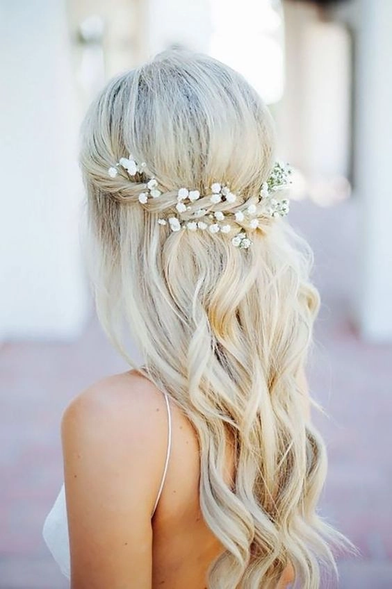 Elegant wedding hairstyle showcasing blonde balayage highlights