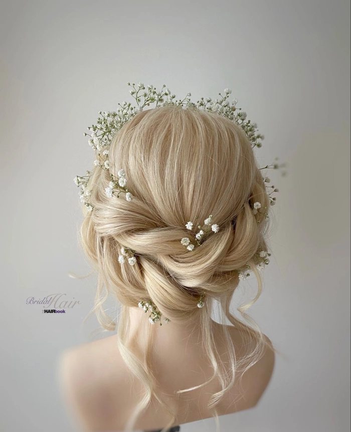 Wedding Hairstyles Collection Image 10 featuring a braided crown design Elegant wedding hair styled in a braided crown with soft waves
