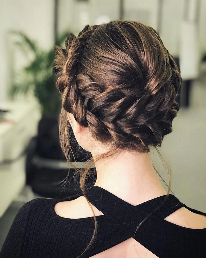 Wedding hair braided crown showcasing intricate and romantic bridal styling Elegant wedding hairstyle with a braided crown perfectly styled for a bride