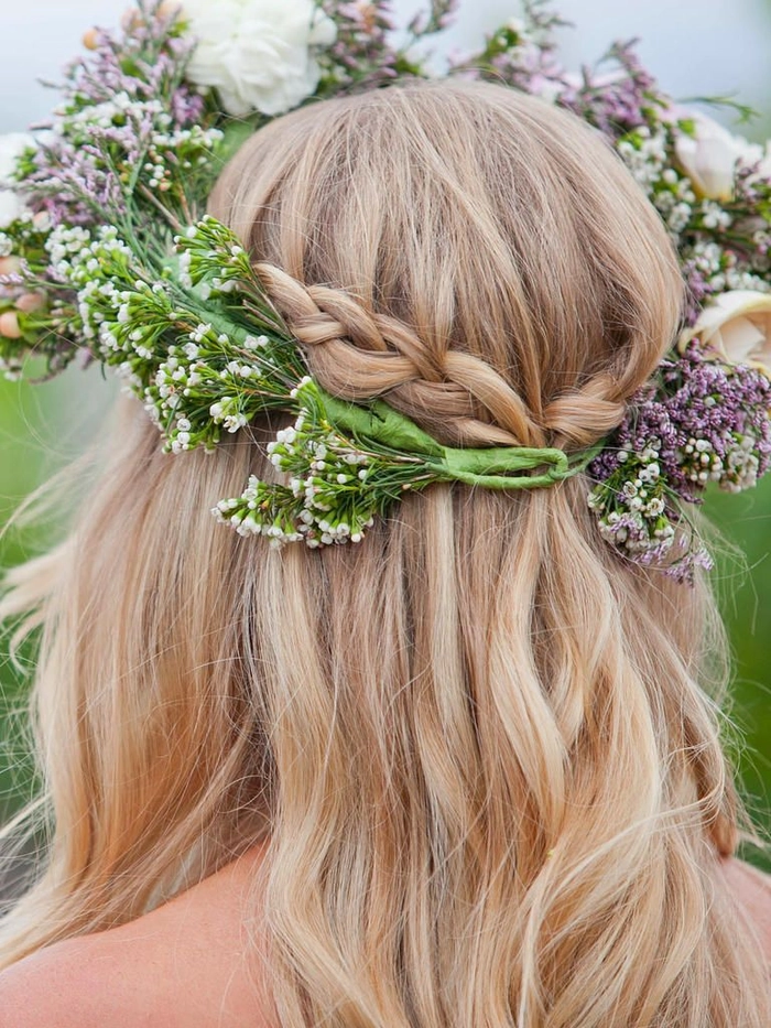Beautiful braided crown hairstyle perfect for a wedding day look Elegant wedding hair braided crown styled with floral accents