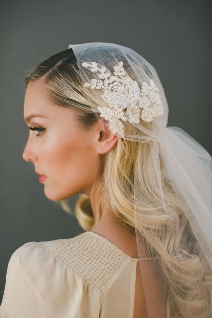 Stunning wedding look featuring a cathedral veil and soft curls hairstyle Elegant bridal hairstyle showcasing intricate curls with a cathedral veil