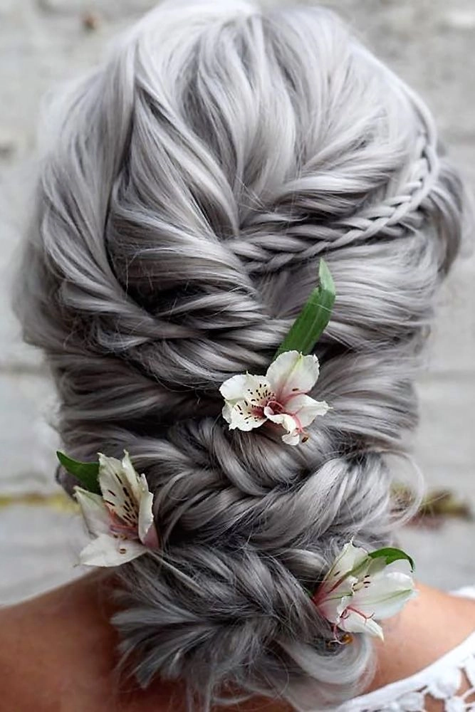 Elegant bridal hair for gray hair with soft curls and floral accessories