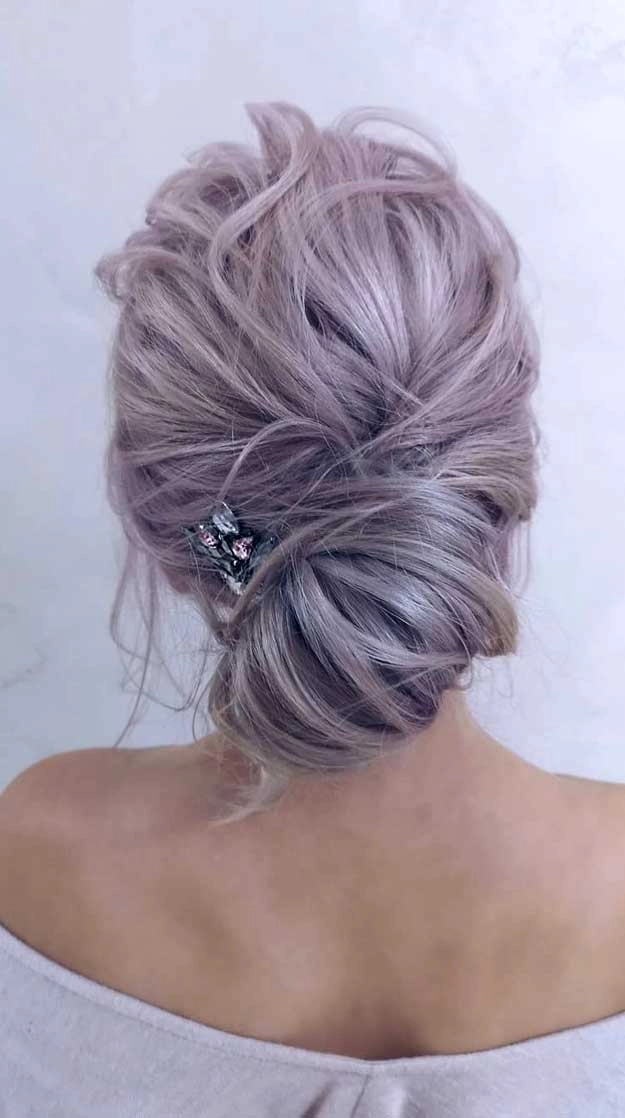 Elegant bridal hair styled for gray hair with delicate floral accents