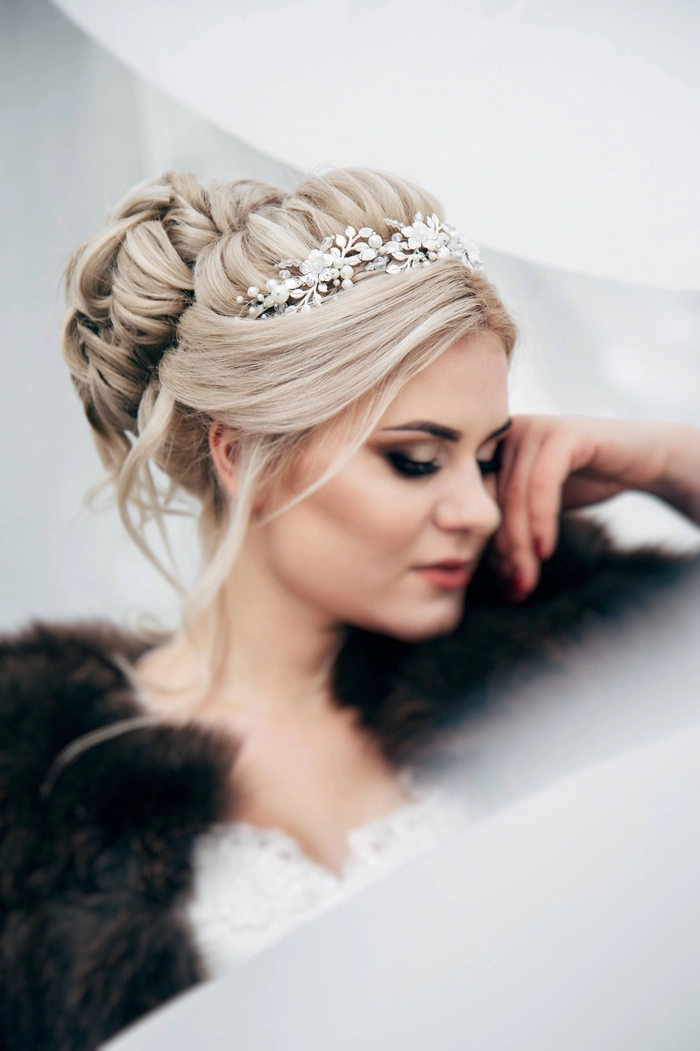 Beautiful bridal hairstyle featuring a sparkling crystal tiara accessory Elegant wedding hair styled with a crystal tiara for a bridal look