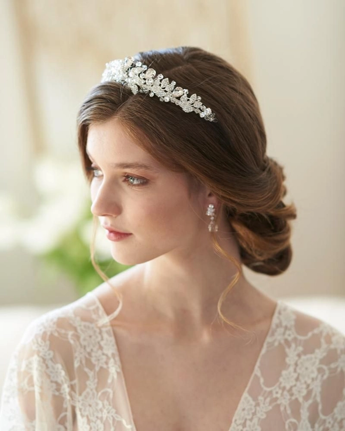 Stunning bridal hairstyle featuring a crystal tiara for a perfect wedding look Elegant wedding hair with a sparkling crystal tiara styled for a bride