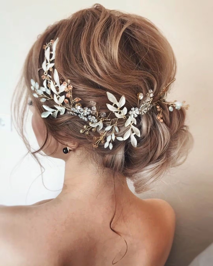 Elegant bridal hair with delicate hairpieces styled for a wedding day