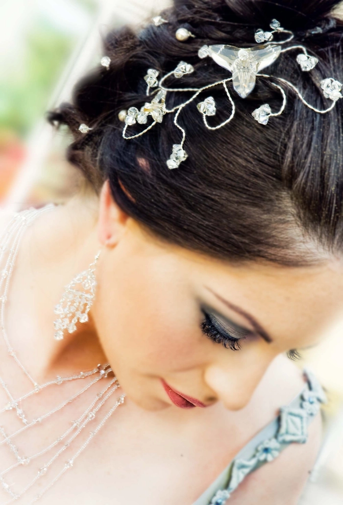 Elegant bridal hair styled with delicate hairpieces for a sophisticated wedding look