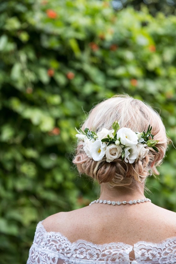 Beautiful wedding hairstyle featuring fresh floral accents for brides Elegant bridal hair adorned with fresh flowers for a romantic wedding look