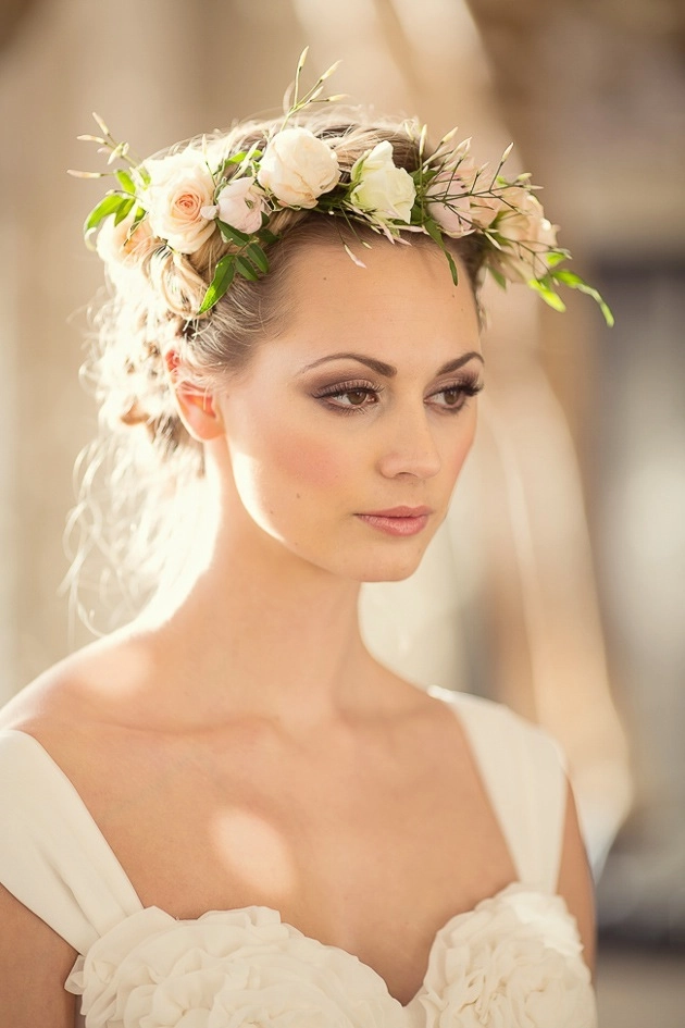 Bridal hairstyle showcasing fresh floral accents perfect for weddings Elegant bridal hair with fresh flowers artfully woven into a soft updo