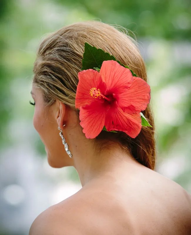 Bridal hair adorned with fresh flowers showcasing a timeless wedding hairstyle Elegant bridal hair styled with fresh flowers for a romantic wedding look