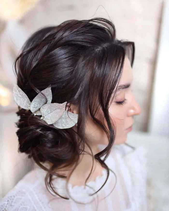 Elegant bridal hair styled perfectly for a heart shaped face with soft curls and volume